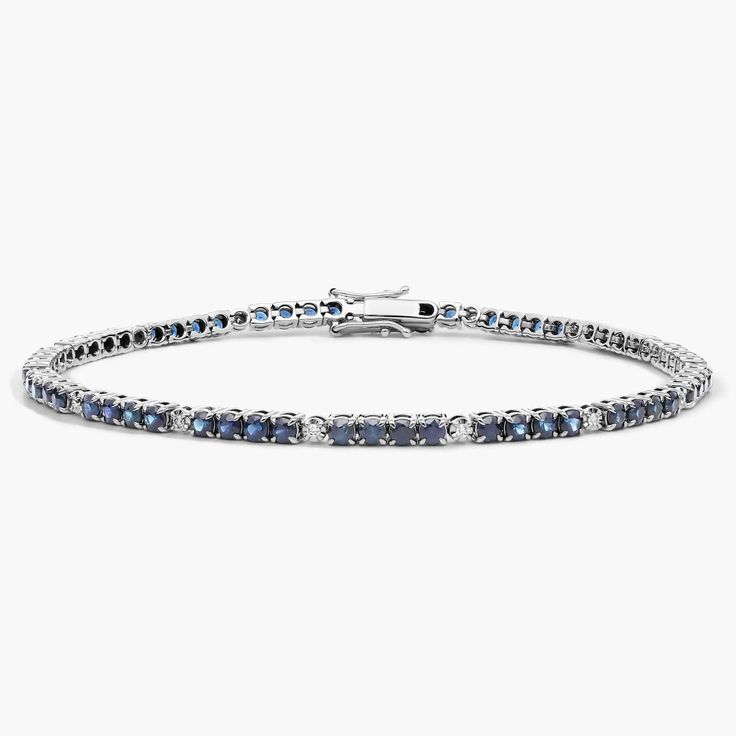 Everything you need to bring dazzling color to your look is here on this 14k white gold bracelet featuring quadruplets of sapphires interrupted by brilliant white diamonds. Classic Sapphire Diamond Bracelet For Anniversary, Classic Diamond Bracelet With Sapphire, White Gold Sapphire Tennis Bracelet For Formal Occasions, Sapphire Diamond Bracelet For Anniversary, Sapphire Bracelets With Prong Setting For Anniversary, Formal Sapphire Bracelets With Diamond Accents, Sapphire Cubic Zirconia Diamond Bracelet For Anniversary, Classic Sapphire Tennis Bracelet With Brilliant Cut, Anniversary Diamond Bracelet With Sapphire