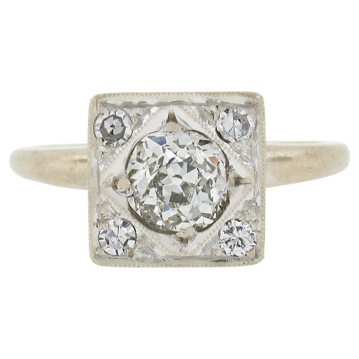 an antique diamond ring with three diamonds in the center