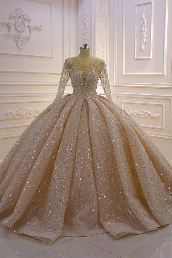 a ball gown is shown on display in a white room with gold trimmings