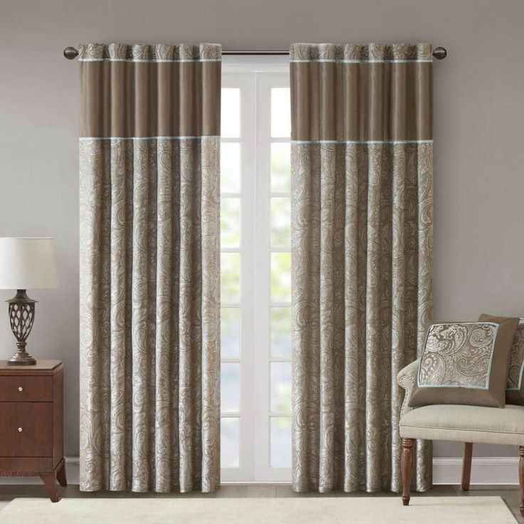 the curtains in this living room are beige and white