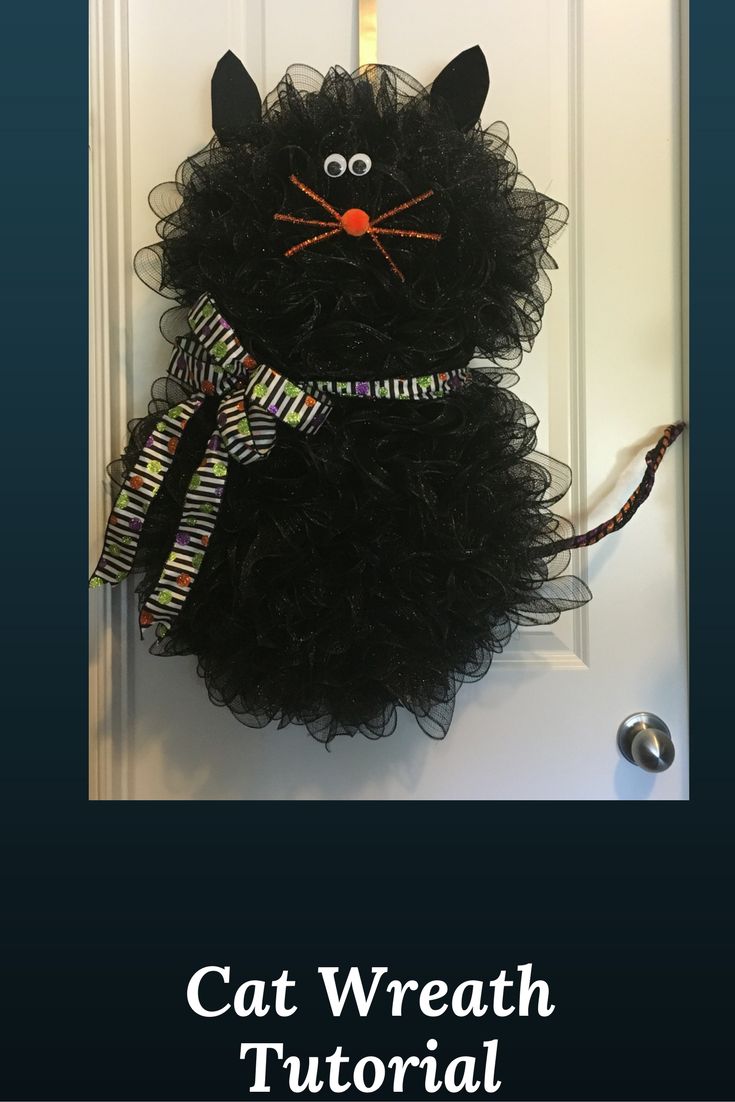 a cat wreath hanging on the front door with text overlay that reads, cat wreath tutor