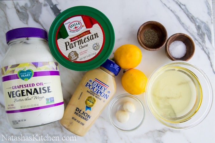 ingredients to make an ice cream smoothie laid out on a marble counter top