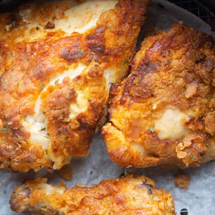 some fried food is sitting on top of the grill paper and ready to be cooked