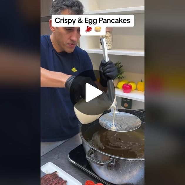 a man is cooking food in a pan on the stove with words that read crispy and egg pancakes