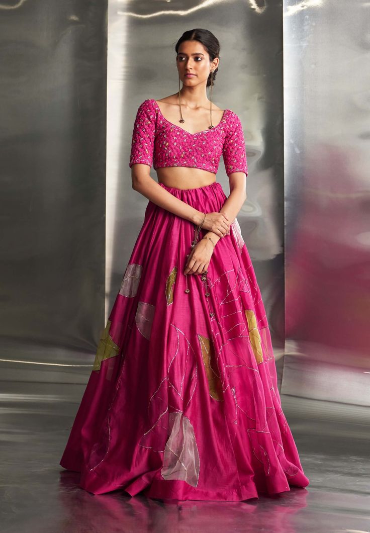 This exquisite ensemble features a hand-embroidered lehenga with intricate nakshi, dabka, and threadwork, extending elegantly across the blouse, lehenga, and dupatta. The detailed craftsmanship and shimmering gold embroidery infuse the outfit with opulence and sophistication, making it perfect for any special occasion. Pink Tissue Silk Set With Zari Work, Pink Chanderi Dress With Intricate Embroidery, Designer Pink Art Silk Lehenga, Pink Anarkali Set With Intricate Embroidery In Art Silk, Tissue Silk Lehenga With Dabka Work For Reception, Elegant Pink Art Silk Lehenga, Pink Tissue Silk Saree Set, Pink Tissue Silk Lehenga With Dabka Work, Pink Organza Lehenga With Dabka Work