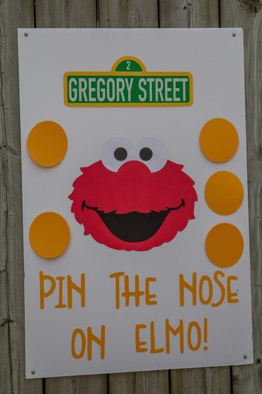 a sign that says pin the nose on elmo with an image of sesame street