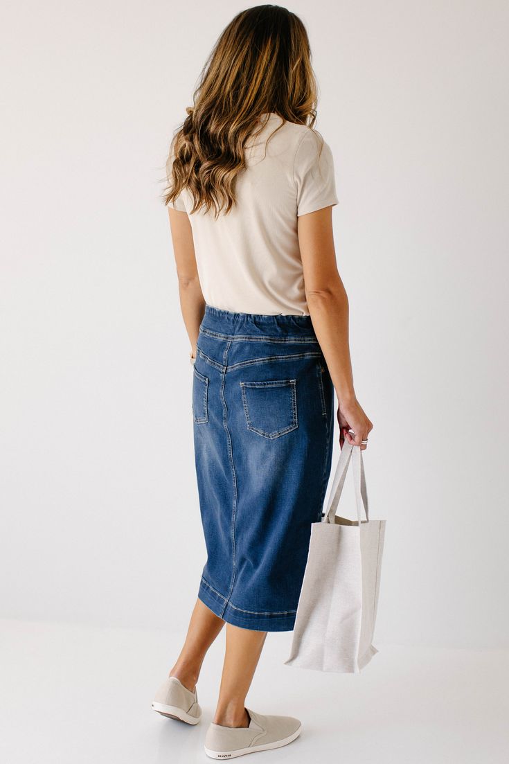 Simple lines, classic and comfortable, the 'Sara' is everything a denim skirt should be. This skirt is made from a quality stretch denim and is as comfy as they come! The classic dark wash pairs well with everything from a timeless button down to a graphic tee. Featuring a wide waistband for extra comfort and ease of styling. Exclusively designed by us for you. 97% Cotton 3% Spandex Machine Wash Cold Do Not Bleach Hang to Dry Low Iron if Needed Do Not Dry Clean Functional Back Pockets Available Medium Wash Denim Pencil Skirt With Pockets, Everyday Medium Wash Straight Leg Bottoms, Straight Leg Medium Wash Bottoms For Everyday Use, Everyday Straight Leg Medium Wash Bottoms, Everyday Denim Bottoms With Pockets, Spring Bottoms With Pockets For Everyday Use, Dark Wash Denim Pencil Skirt With Pockets, Casual Medium Wash Skirt For Everyday, Casual Dark Wash Denim Pencil Skirt