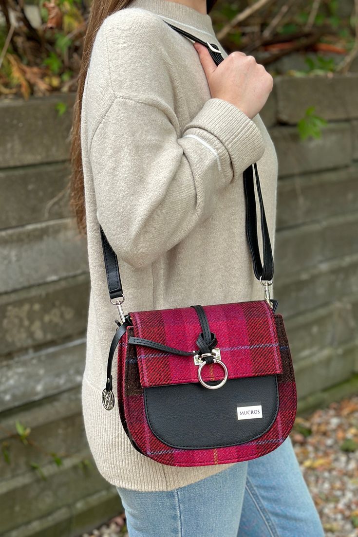 A Fall colored plaid bag with a sophisticated look. Made in Ireland with premium materials and carefully created with 200 year old looms, this bag will bring your look style and class. Has a zipper, hand strap, crossbody strap, and spacious inside for your purse essentials. Made with 100% Wool & PU Leather Length: 9", Width: 3.5", Height 8.5" Plaid Bags With Adjustable Strap, Plaid Bags With Adjustable Strap For Everyday Use, Everyday Plaid Bag With Adjustable Strap, Plaid Bag With Adjustable Strap For Daily Use, Plaid Shoulder Bag For Everyday Use, Plaid Satchel Shoulder Bag For Travel, Plaid Shoulder Bag With Adjustable Strap For Daily Use, Everyday Use Plaid Bags, Plaid Rectangular Shoulder Bag With Adjustable Strap