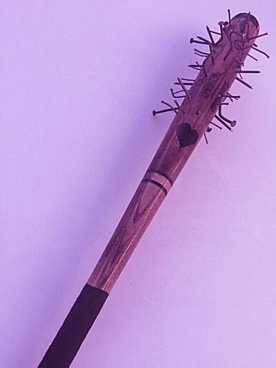 a close up of a wooden brush with spikes on it