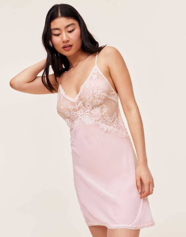 Our lovely and romantic Raquel slip dress is unlined, has adjustable ties in the back, and is made from sheer georgette and lace in a beautiful bright white. It's the perfect lingerie to add some romance to your night. (Available in sizes XS-XL.) Spaghetti Strap Slip Dress With Delicate Lace, Feminine Summer Lace Dress With Lace Back, Flirty Delicate Lace Summer Dress, Delicate Lace Trim Summer Sleepwear, Spring Lace Backless Slip Dress, Feminine Lace Slip Dress With Spaghetti Straps, Lace Slip Dress With Delicate Straps For Daywear, Feminine Camisole Slip Dress For Sleep, Fitted Lace Back Slip Dress For Wedding Night