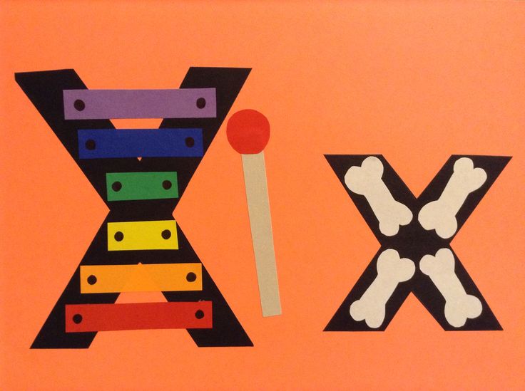 the letter x is made out of construction paper and colored pencils on an orange background