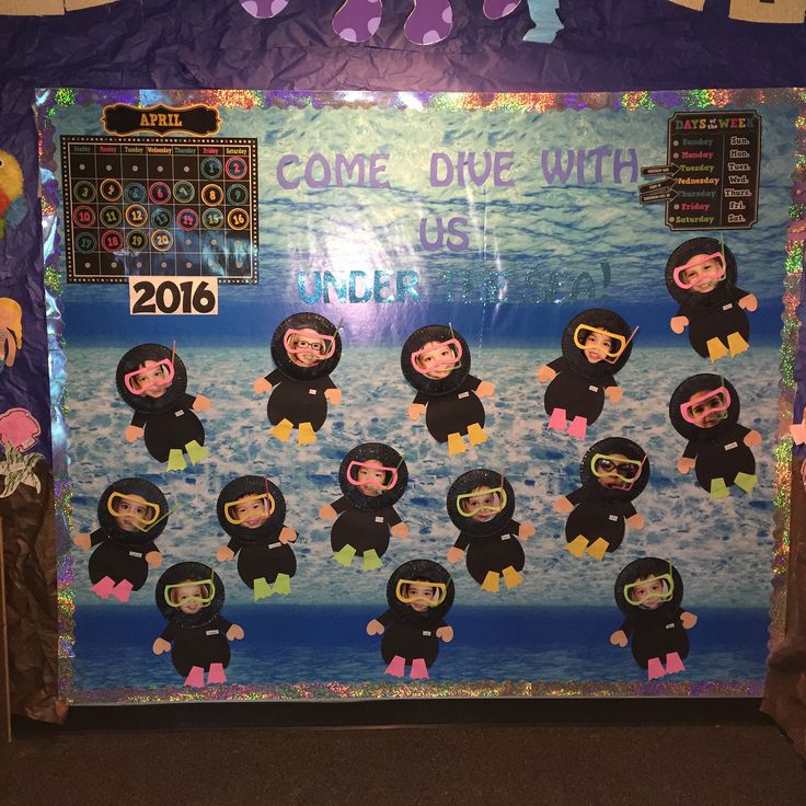 a bulletin board is decorated with cartoon characters and the words come dive with us written on it