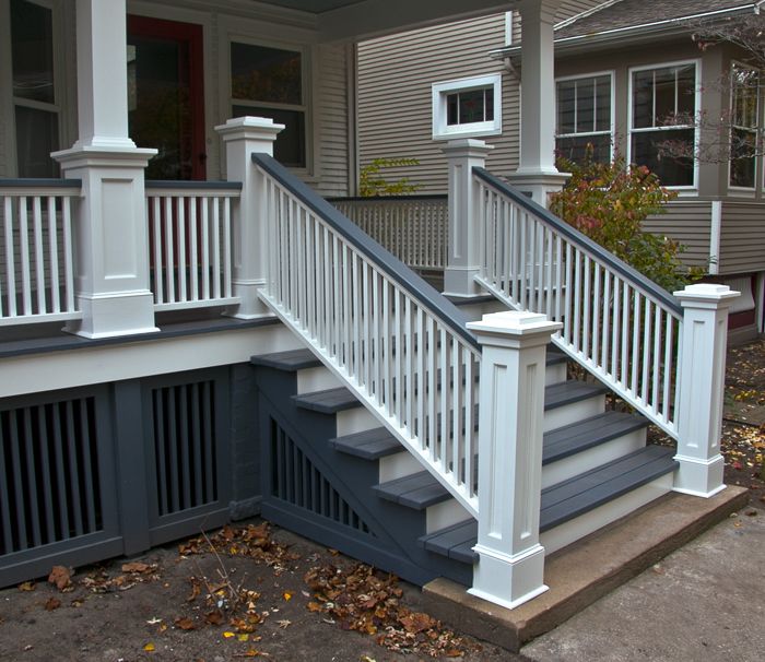 a white railing on the side of a house