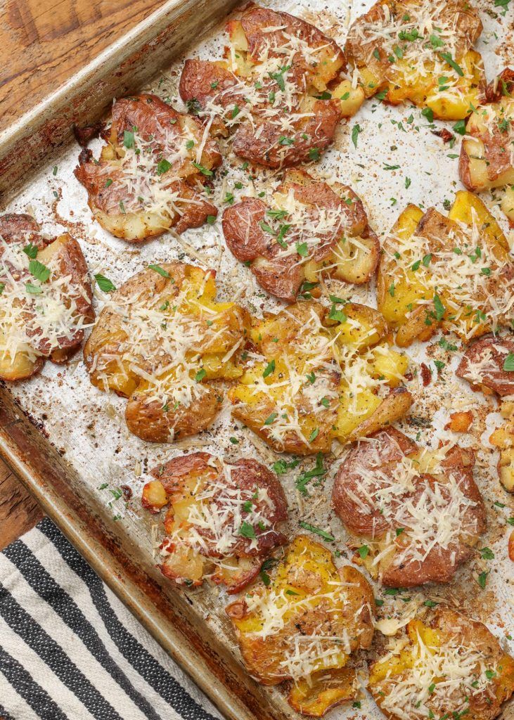 a pan filled with potatoes covered in parmesan cheese and topped with pepperoni