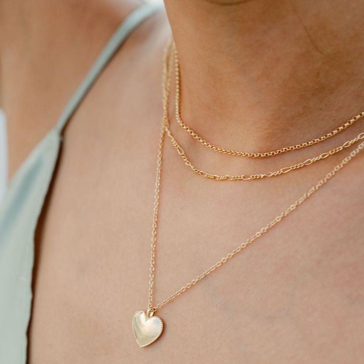 Easy, effortless, refined. We love our dainty chain necklaces. They can be worn on their own for a minimal look or layered with your other pieces for more of a statement. Length: 12 inches with 4 inches extension chain 14k gold filled chain, clasp and findings Handmade in America Everyday Gold Plated Heart Necklace, Delicate 14k Gold Filled Charm Necklaces For Layering, Delicate Heart Chain Necklace For Everyday, Everyday Heart Shaped Delicate Chain Necklace, Dainty Charm Necklace For Layering, Everyday Delicate Heart Chain Necklace, Everyday Minimalist Heart Necklace, Gold Figaro Chain Layered Necklace For Everyday, Gold Layered Figaro Chain Necklace For Everyday