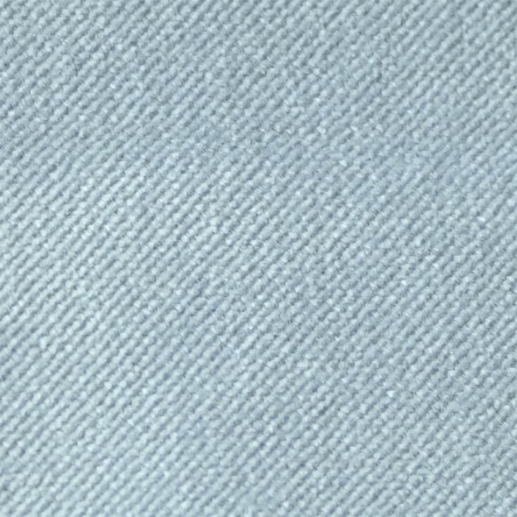 a close up view of a light blue carpet