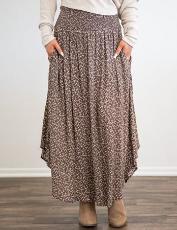 Mia Midi Skirt Fall Daywear Skirted Bottoms, Casual Midi Length Floral Print Bottoms, Floral Print Skirted Bottoms For Fall, Spring Maxi Skirt With Pockets For Daywear, Flowy Midi Length Bottoms For Day Out, Printed Brown Bottoms For Spring, Tiered Maxi Skirt With Pockets For Day Out, Long Skirt With Pockets For Daywear, Versatile Gathered Skirt Bottoms For Spring