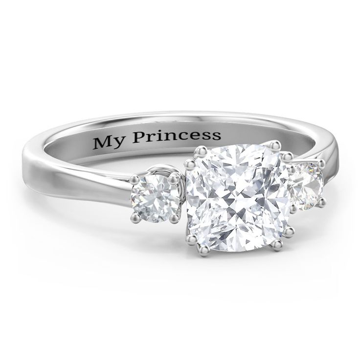 a three stone engagement ring with the words my princess on it