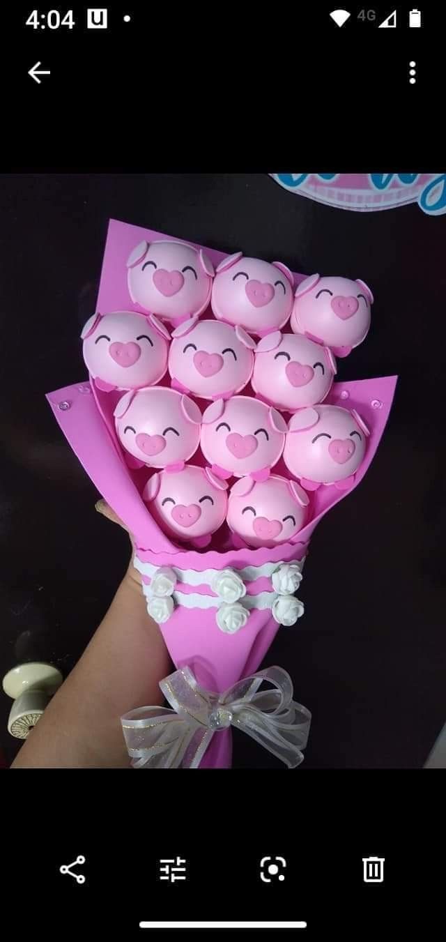 a bunch of pink cupcakes in a bouquet