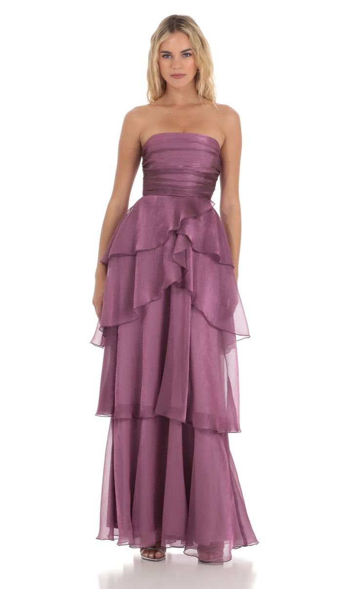 a woman in a strapless purple dress