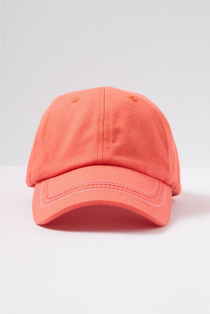 an orange baseball cap on a white background