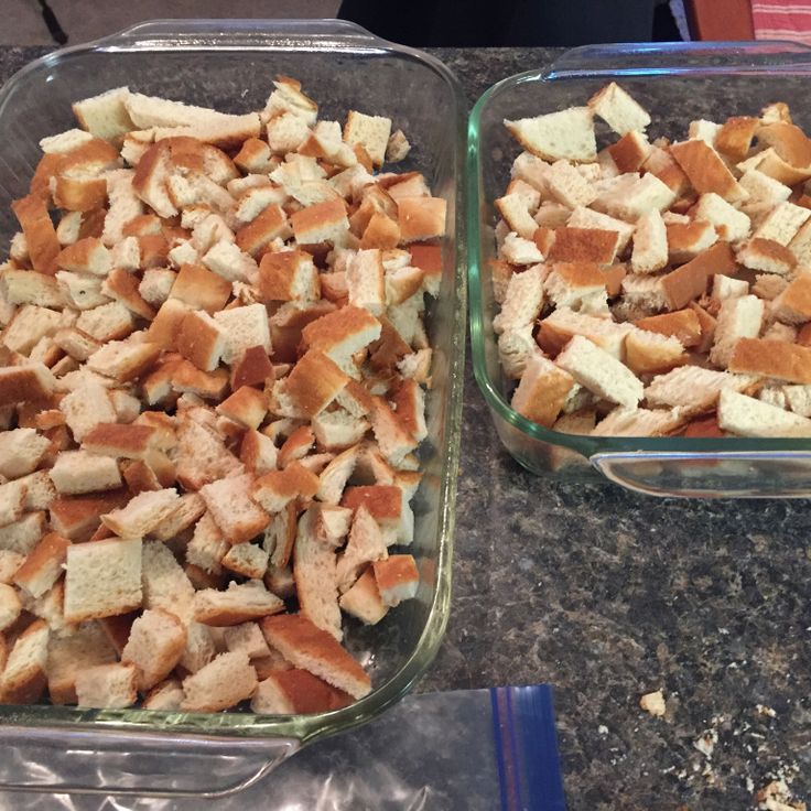 two glass dishes filled with food sitting on top of a counter