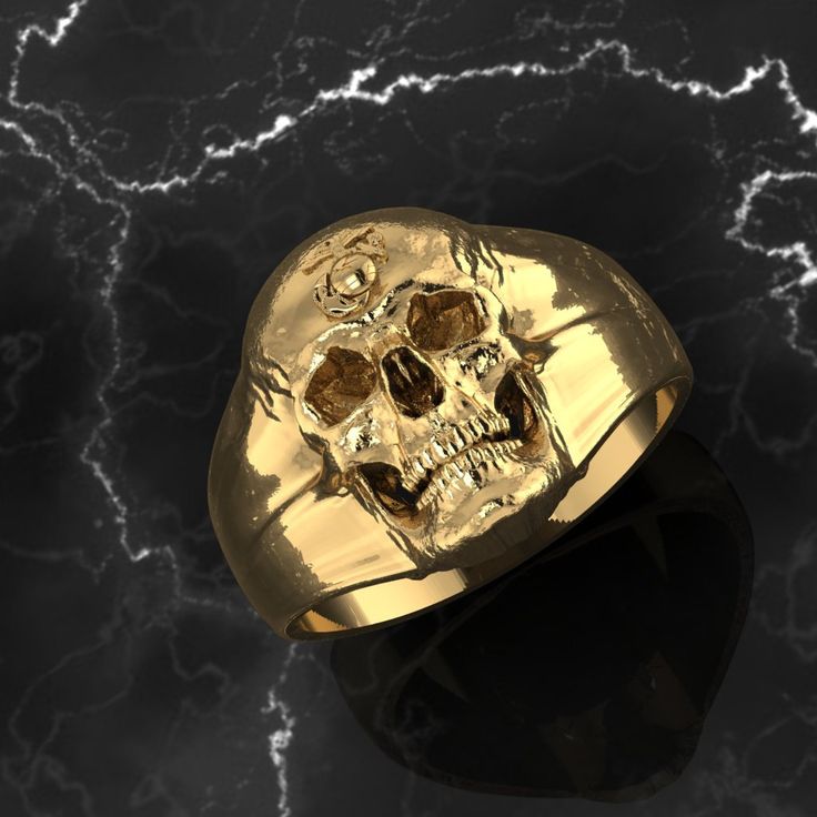 "Amazing Marine Corps Skull Ring with EGA located on the forehead of the skull. Available in sterling silver, 10k or 14k gold *Every ring we design and handcraft is made by a Marine Corps Veteran at our shop in Lakewood, Colorado - Proudly Made in USA. *Amazing Custom Marine Corps Ring made by a USMC Veteran. Officially licensed and approved by the US Marine Corps! *MADE BY A MARINE FOR MARINES! (TM) *These USMC Rings are Solid, bold, powerful and of substantial weight! Durable and Marine Tough! Classic Skull Ring As Gift, Luxury Skull Ring As Gift, Gold Skull Ring Collectible, Gift Skull Ring With Polished Finish, Skull Ring With Polished Finish As Gift, Gold Skull Shaped Collectible Ring, Marine Corps Rings, Lakewood Colorado, Usmc Veteran