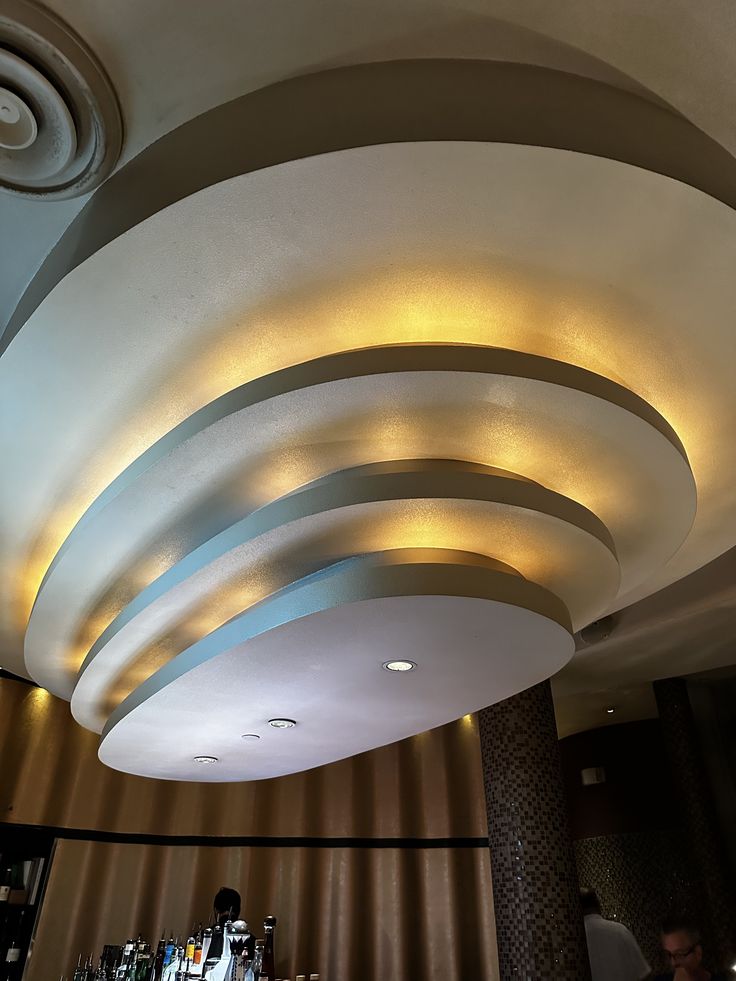 the ceiling is decorated with circular lights