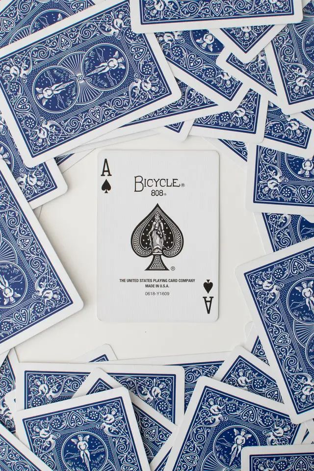 a pile of blue and white playing cards