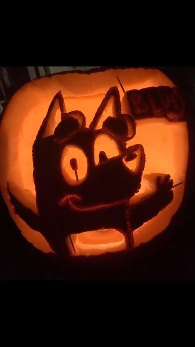 a pumpkin carved to look like a cat