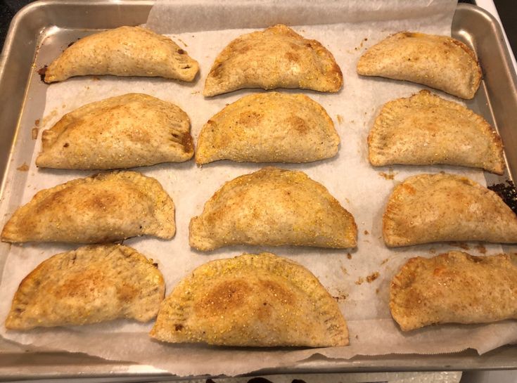 six pieces of chicken are on a baking sheet ready to go into the oven,