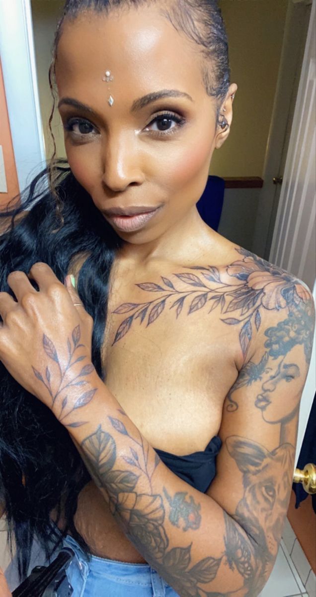 Full sleeve, chest, hand, and wrist tattoo on a black woman Mandala Tattoo Black Women, Hand Floral Tattoos For Women, Full Arm Tattoos For Black Women, Black Women Full Sleeve Tattoo, Full Sleeve Tattoos Women Black, Spiritual Sleeve Tattoos For Black Women, Black Women With Tattoos, Girl Arm Sleeve Tattoo Black Women, Tatted Women