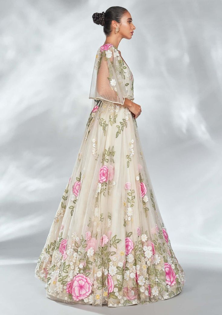 Editor's Note The multi floral gown is set in a sheer tulle base and adorned with intricate floral embroidery details and pearls on the sleeve hem. This piece is further accentuated with an exquisite pearl belt. Color: Nude Fabric: Tulle Components: Gown and belt Occasion: Reception Disclaimer: Product color may slightly vary due to photographic lighting sources or your monitor setting. Care: Dry Clean Only About the Designer Shriya Som is engaged in the design, manufacture, and distribution of Spring Evening Dress In Organza With Floral Embroidery, Spring Organza Evening Dress With Floral Embroidery, Formal Organza Dress With Floral Embroidery, Feminine Floral Applique Wedding Dress, Elegant Tulle Gown With Floral Embroidery, Floral Embroidered Lace Maxi Gown, Lace Maxi Gown With Floral Embroidery, Spring Party Gown With Intricate Embroidery, Elegant Floral Embroidered Organza Dress