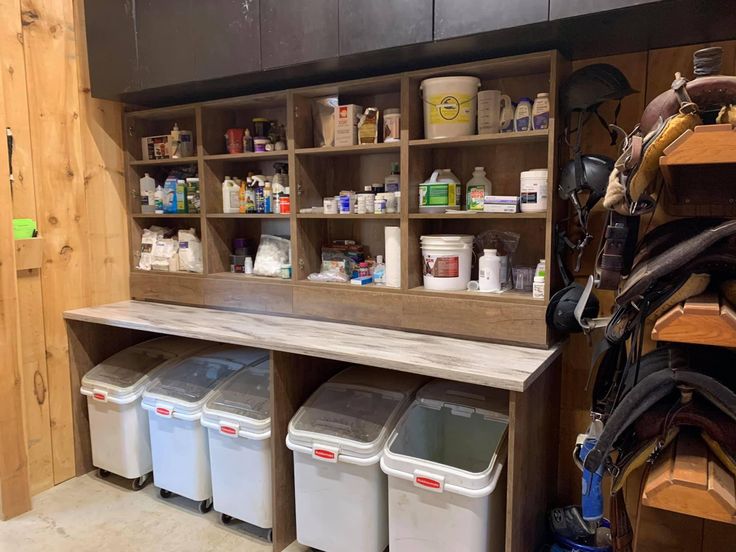 several bins are lined up against the wall