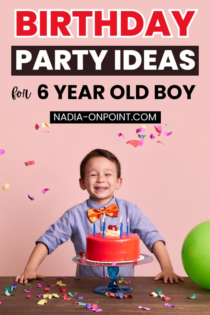 a young boy sitting in front of a birthday cake