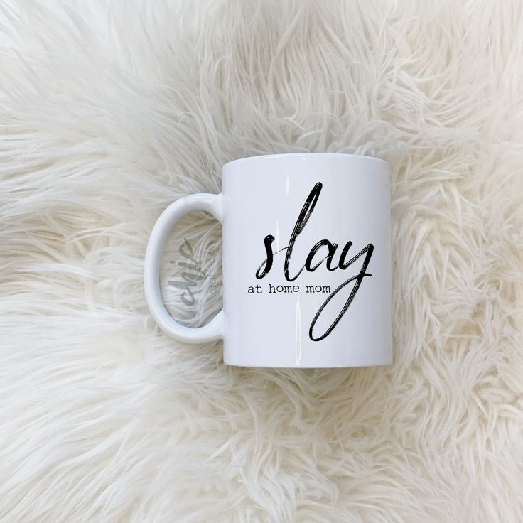 a white coffee mug with the words stay at home mom written in black on it