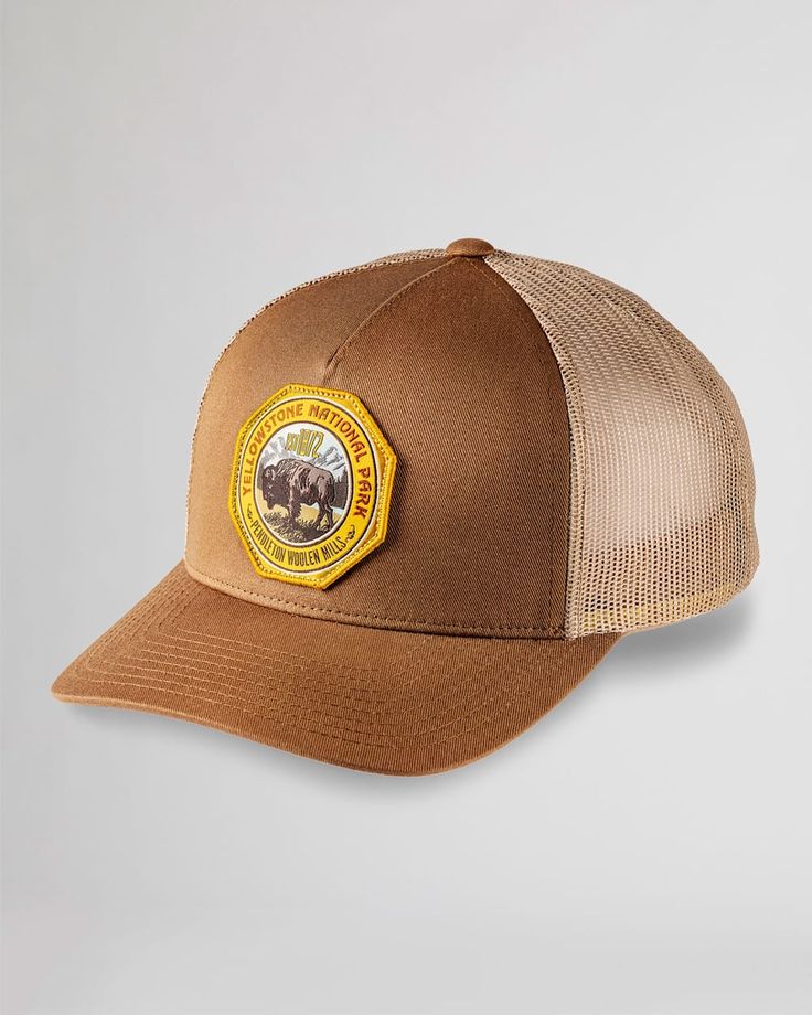 Experience the beauty our beloved national parks with our five-panel cap featuring a unique and iconic national park emblem. Breathable mesh panels and an adjustable snap back make this hat a comfortable and stylish choice for any outdoor adventure! National Park Trucker Hats: Material: Polyester & cotton. One size fits all. Care: Spot clean. Pendleton is proud to support the National Park Foundation, the official charity of America's national parks. More than $1.3 million has been contributed so far thanks to customers like you. Check out our Facebook Photos for fun and inspirational ideas on decorating any space! Don't forget to follow and like our page while you're there. Brown Trucker Snapback Hat For Outdoor, Camping Trucker Hat With Logo Patch, Logo Patch Trucker Hat For Camping, Brown 5-panel Trucker Hat For Outdoor, Outdoor Brown Baseball Cap With Logo Patch, Brown Outdoor Baseball Cap With Logo Patch, Trucker Baseball Cap With Flat Brim For Outdoor, Brown Trucker Hat With Logo Patch For Outdoor, Trucker Hat With Curved Brim For Travel