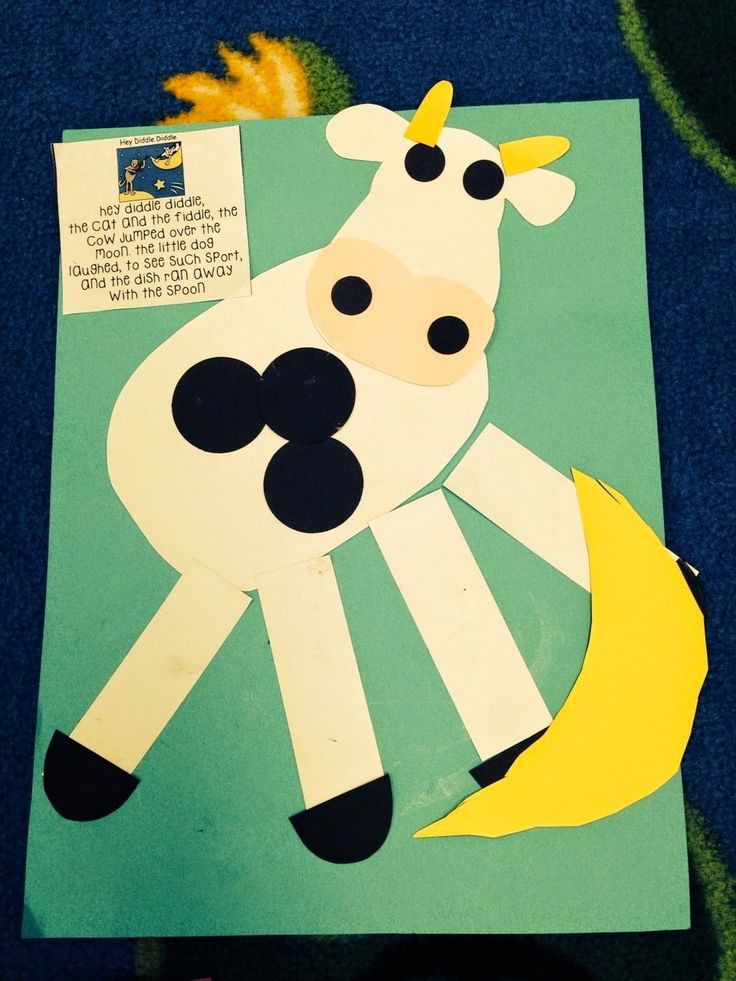 a paper cut out of a cow with a yellow horn on it's head