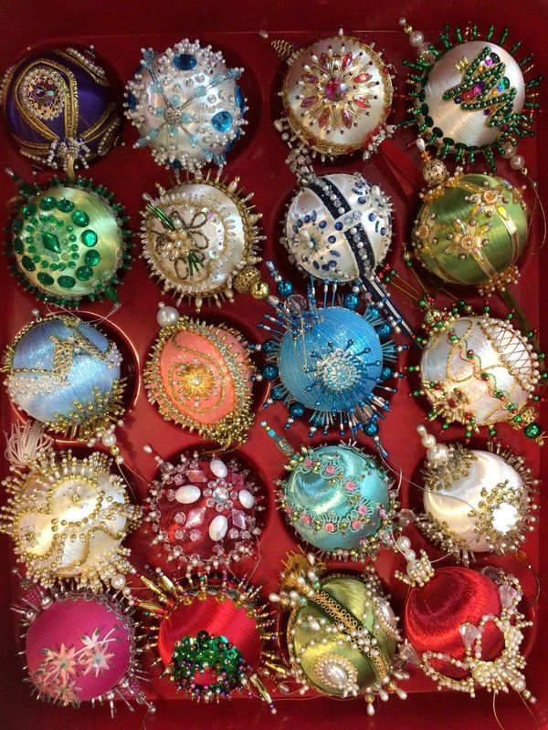 a red box filled with lots of different colored ornaments