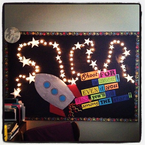 a bulletin board decorated with stars and lights