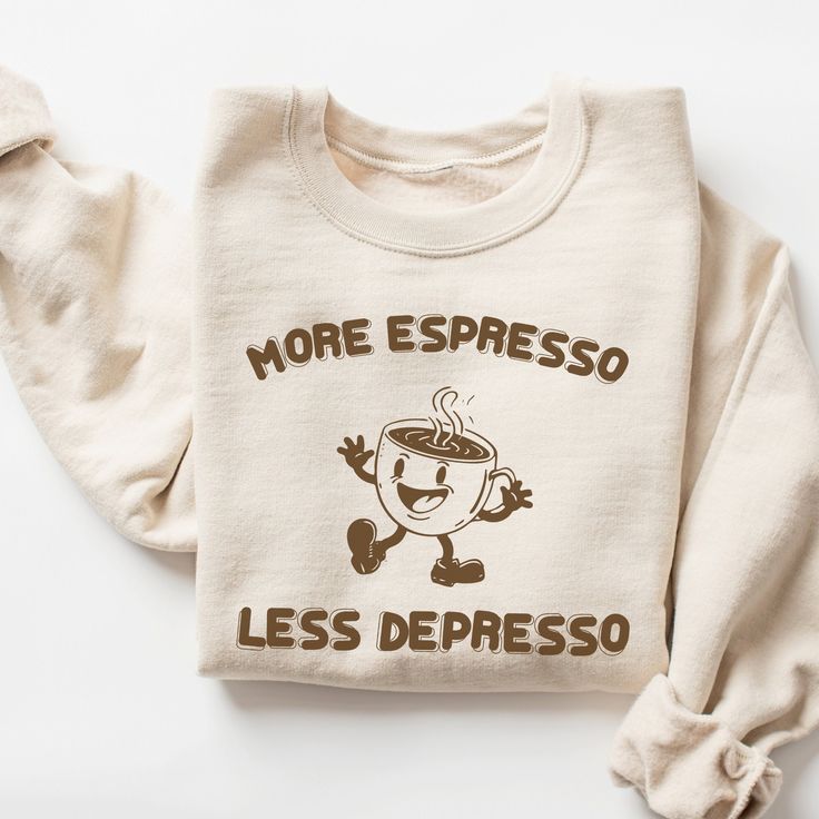 More Espresso Less Depresso Sweatshirt, Funny Coffee Sweatshirt, Vintage Retro Coffee Shirt, Mental Health Shirt, Trendy Oversized Shirt 🧵 HOW TO ORDER   - Pick your size and color from the drop down menus  - Review the sizing and color options in the listing photos  - Add the item to your cart and complete the checkout process  - We'll start working on your order right away! 🧵SIZING  - Please review the listing photos to see the size charts  - These photos will also show you how to order a regular/relaxed fit or an oversized fit 🧵PRODUCT DETAILS  - This unisex heavy blend crewneck sweatshirt is pure comfort. These garments are made from polyester and cotton. This combination helps designs come out looking fresh and beautiful. The collar is ribbed knit, so it retains its shape even afte Coffee Long Sleeve Top With Letter Print, Coffee Color Long Sleeve Top With Letter Print, Coffee Long Sleeve T-shirt With Letter Print, Coffee Crew Neck Top For Loungewear, Comfortable Long Sleeve Graphic T-shirt, Coffee Crew Neck Top With Slogan, Coffee Crew Neck Top With Funny Print, Coffee Long Sleeve T-shirt With Graphic Print, Coffee Colored Crew Neck Top With Slogan