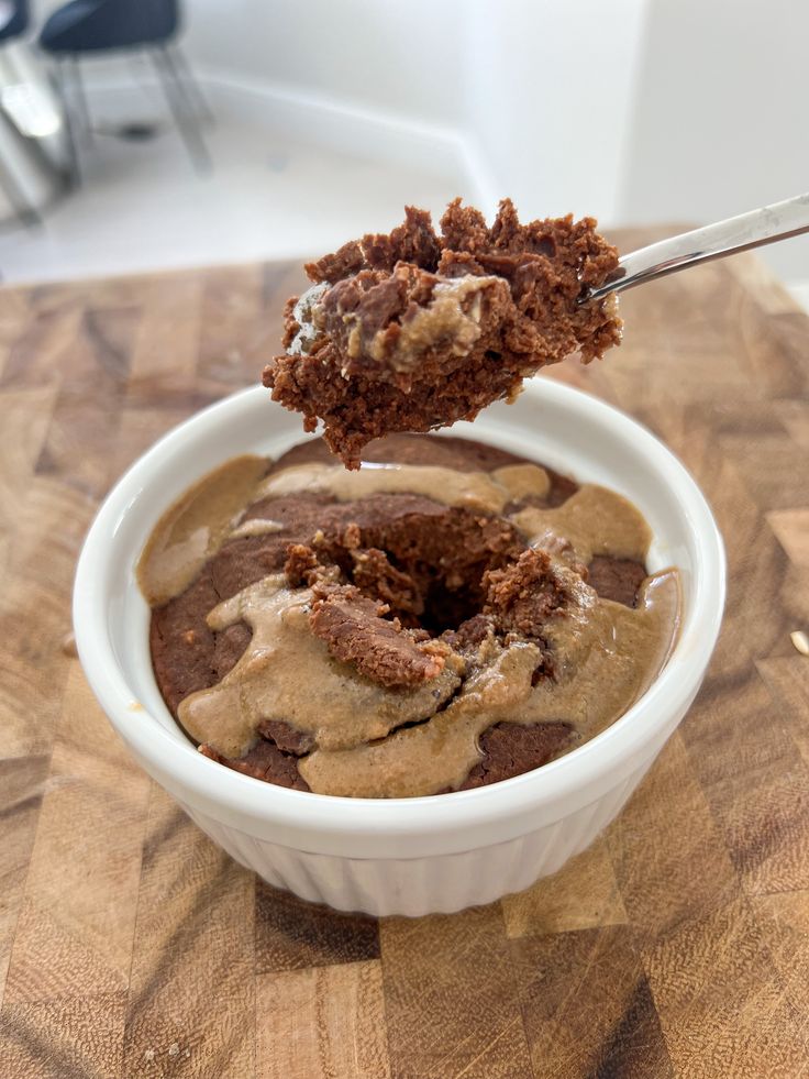 a spoon with some food in it on a table