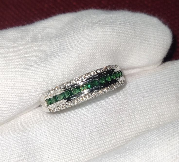 Stunning Emerald Princess Cut Simulated Emerald Engagement & Anniversary Ring - 14K White Gold Finish over 925 Sterling Silver Elevate your love story with this captivating Emerald Princess Cut Simulated Emerald Ring, a perfect blend of elegance and sophistication. Set in a luxurious 14K white gold finish over sterling silver, this ring features a breathtaking princess cut simulated emerald flanked by a sparkling band of simulated diamonds. ✨ Key Features: Exquisite Princess Cut Simulated Emeral Luxury Channel Set Emerald Ring For Anniversary, White Gold Emerald Ring For Anniversary, Princess Cut, White Gold Emerald Ring Princess Cut For Anniversary, Princess Cut Emerald Ring In White Gold For Anniversary, White Gold Emerald Cut Jewelry For Anniversary, Formal Emerald Channel Set Jewelry, Emerald Ring With Diamond Channel Set For Anniversary, Sterling Silver Emerald Cut Channel Set Rings, Sterling Silver Channel Set Emerald Cut Ring