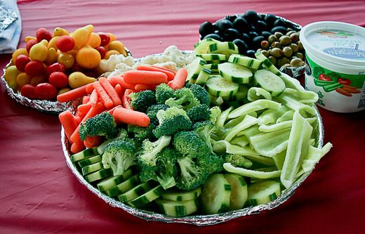 a table topped with bowls filled with lots of veggies