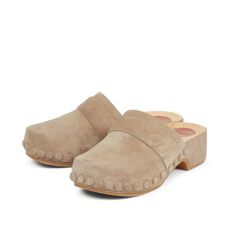 Chlo Joy Suede Clogs Chlo Classic, The Joy Clog Is Crafted From Suede Calfskin For A Sensuous And Luxurious Feel. Set On A Low, Lightweight Wooden Sole With An Anatomic Footbed, This Open-Back Clog Is Extra Comfortable Yet Feminine. Tonal Covered Studs Add Elegant Refinement While The Maison's "O" Signature Puts The Finishing Touch On The Inner Sole. Heel Height: 2" (5 Cm) Heel-To-Toe Drop: 1” (2.5 Cm) - Inner Sole: 95% Abachi Wood, 5% Calfskin - Upper: Calf Split Suede - Sole: 85% Polyurethane, 15% Abachi Wood - Lining: Calfskin Fit True To Size, European Fit - Slip-On Box Has Some Stains/ Damage But Clogs Are New Never Worn Size 35/5 Beige Suede Clogs With Round Toe, Beige Suede Closed Toe Clogs, Beige Leather Closed Toe Clogs, Beige Suede Clogs With Leather Sole, Beige Mules With Wooden Heel And Round Toe, Beige Mules With Suede Lining And Round Toe, Beige Round Toe Mules With Suede Lining, Beige Clogs With Wooden Heel And Round Toe, Spring Suede Lined Closed Toe Clogs