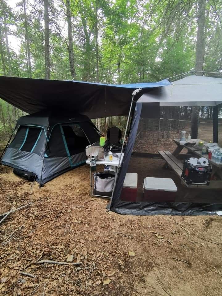 a tent is pitched up in the woods