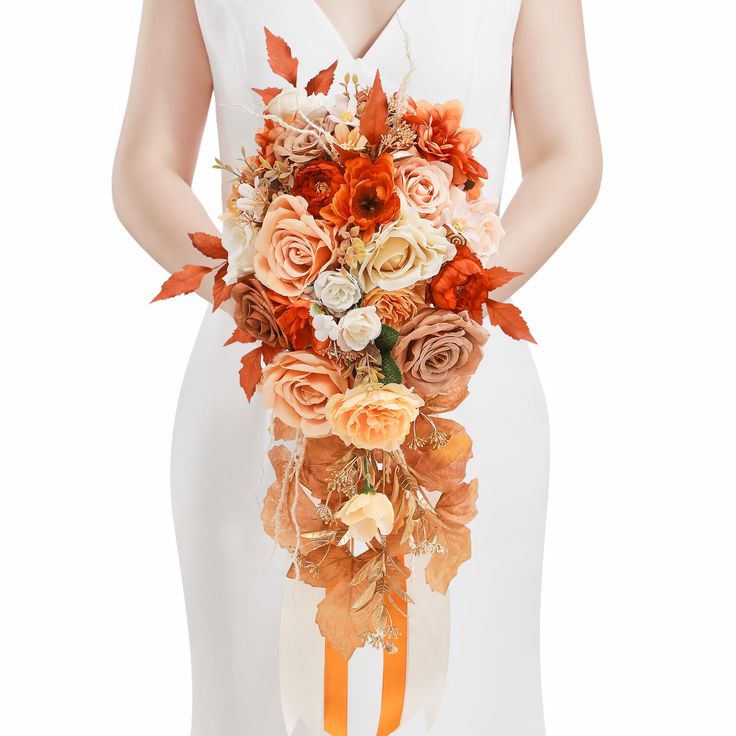 a woman holding a bouquet of flowers in her hands and wearing a white dress with an orange sash