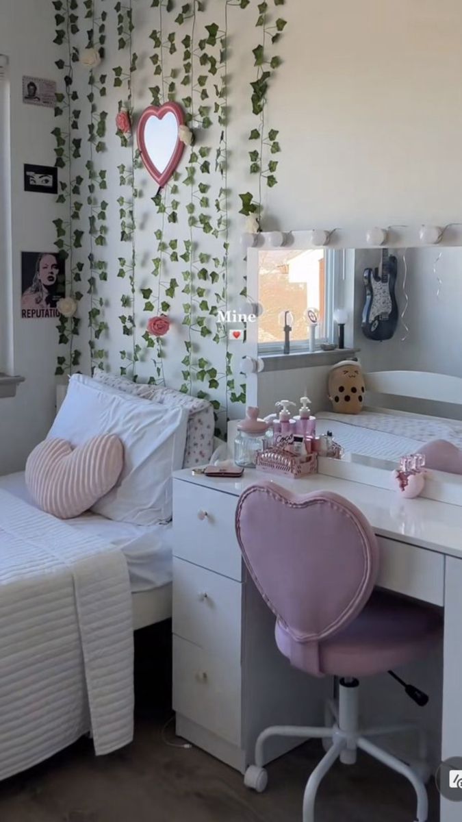 a bedroom with two beds and a desk in front of a mirror that has ivy growing on it