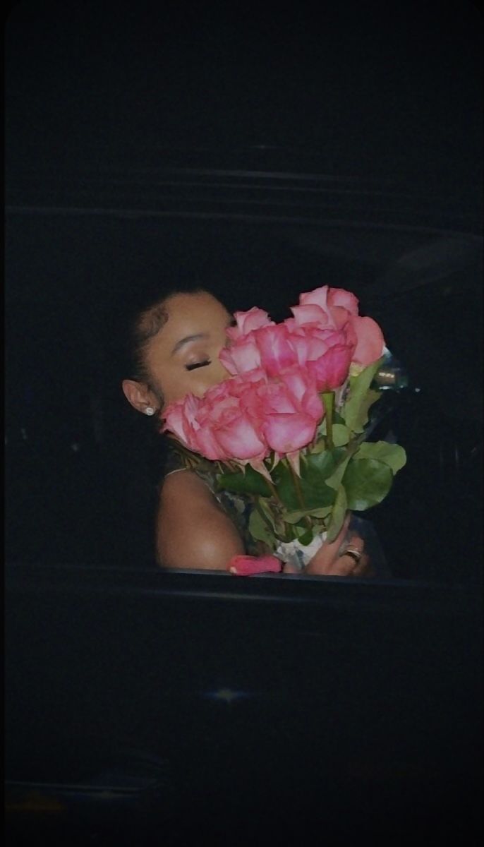 a woman holding a bunch of pink roses in her hand with the words i reserve good things on it