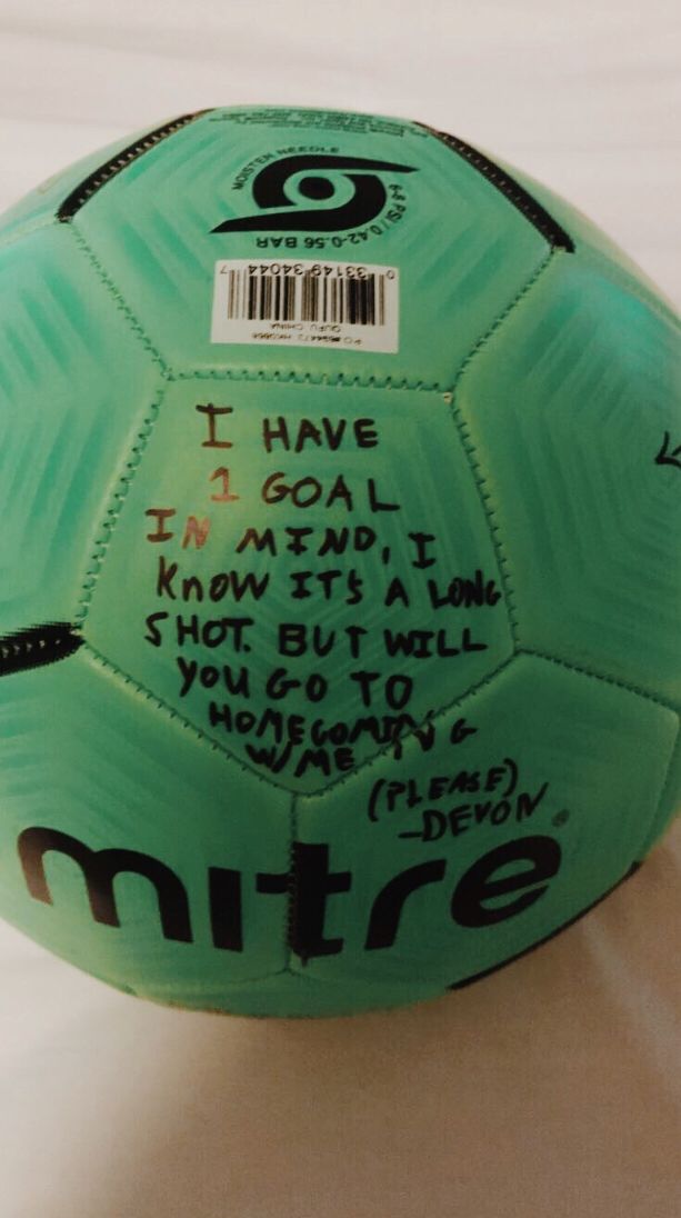 a green soccer ball with writing on it